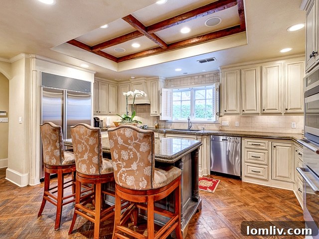 Grand double-height vestibule with a sweeping main staircase at 4604 Alta Drive
