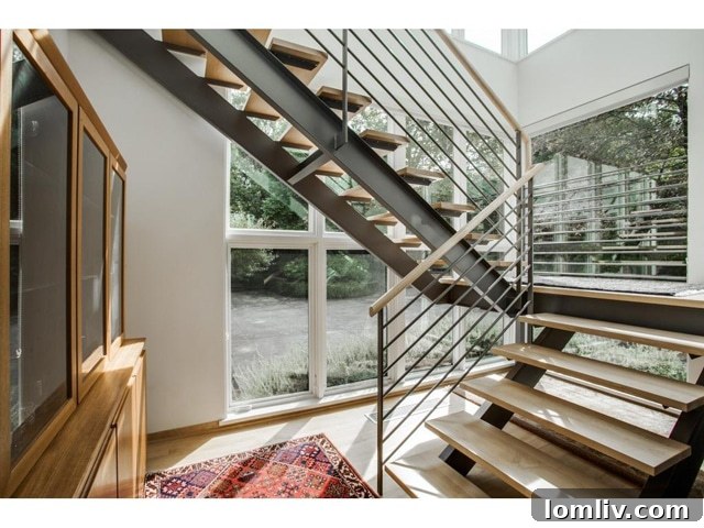 Bluffview Contemporary: An Illuminated Realm of Expansive Design 6 Modern Steel Staircase in Wildwood Home