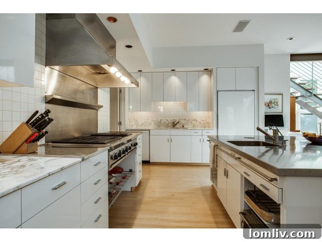 Bluffview Contemporary: An Illuminated Realm of Expansive Design 8 Gourmet Kitchen with Marble Counters and Island