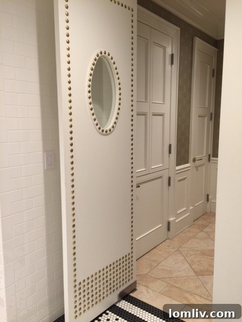 Luxurious padded and studded doors within The Stoneleigh Residences, showcasing sophisticated craftsmanship.