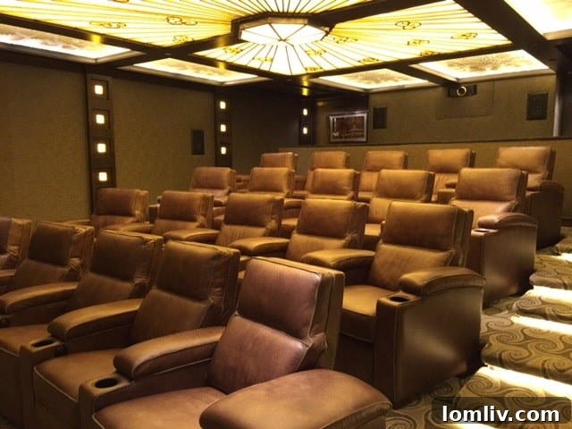 Exclusive 26-seat private movie theater at The Stoneleigh Residences, featuring luxurious leather reclining chairs and illuminated onyx panels.