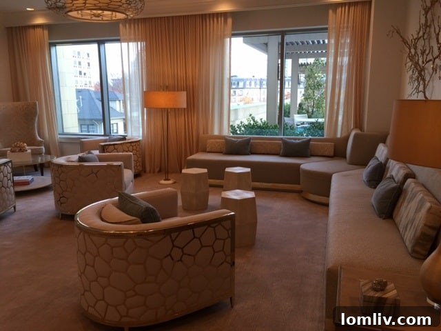 Lounge area adjacent to The Stoneleigh Residences ballroom, featuring comfortable seating and sophisticated decor.