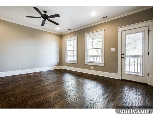 Kings Highway New Build: Modern Decor, Exceptional Finishes 12 Cozy bedroom with ample natural light from large windows