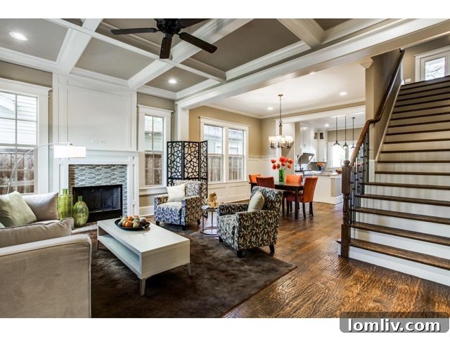 Spacious living room featuring a mosaic fireplace and large windows