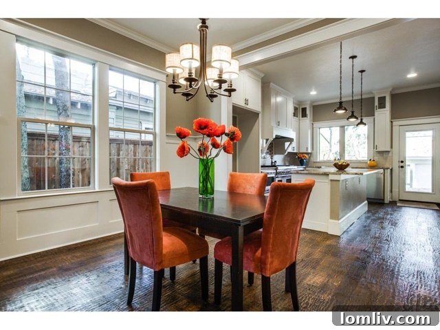 Open concept dining room adjacent to the kitchen with dark hardwood floors
