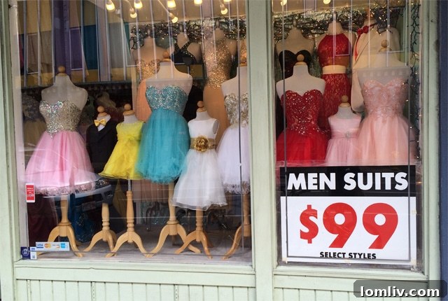 Chinatown signage in Honolulu, featuring a humorous dress shop sign.