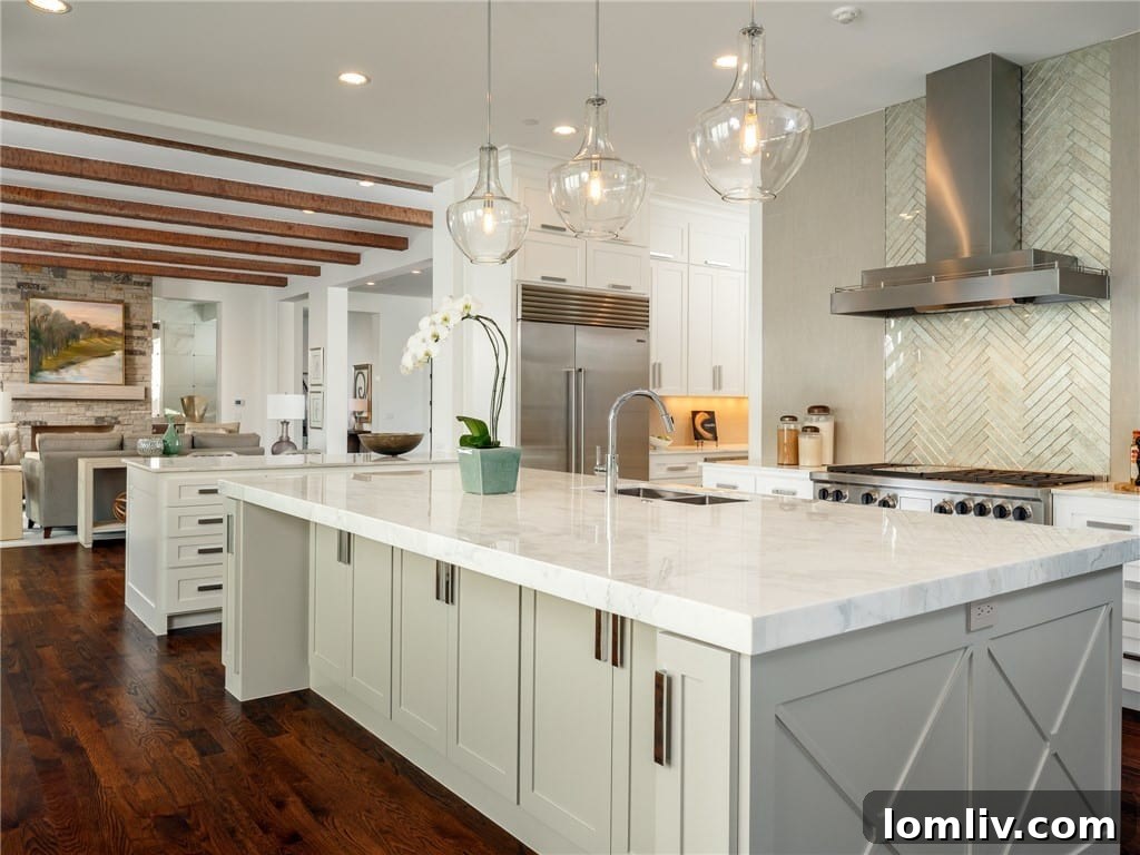 Gourmet kitchen with Calcutta Crema marble countertops and Ann Sacks tiles