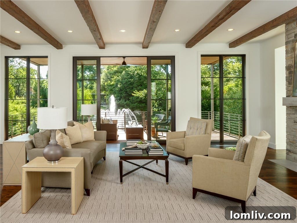 Elegant formal living room with exposed beams and water views