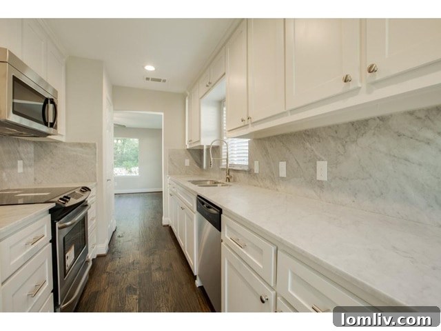 Sleek Galley Kitchen with Carrera Marble Countertops