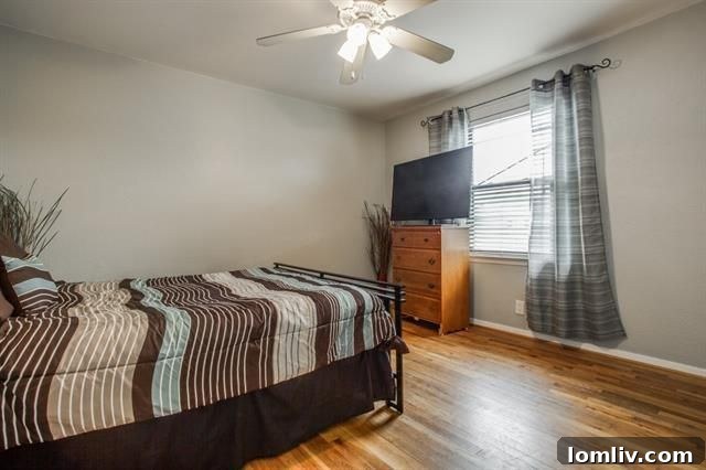 Updated powder room on the main level, featuring a modern sink and tasteful decor.