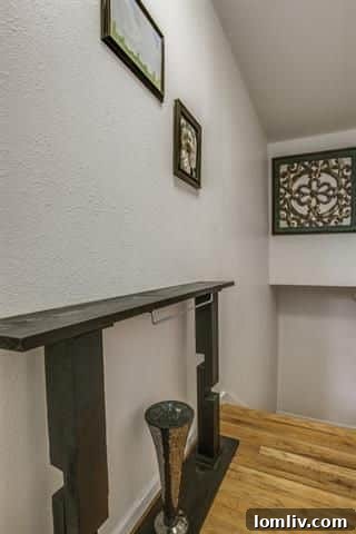 Exterior view of the private, fenced backyard area, perfect for a small grill or outdoor seating.