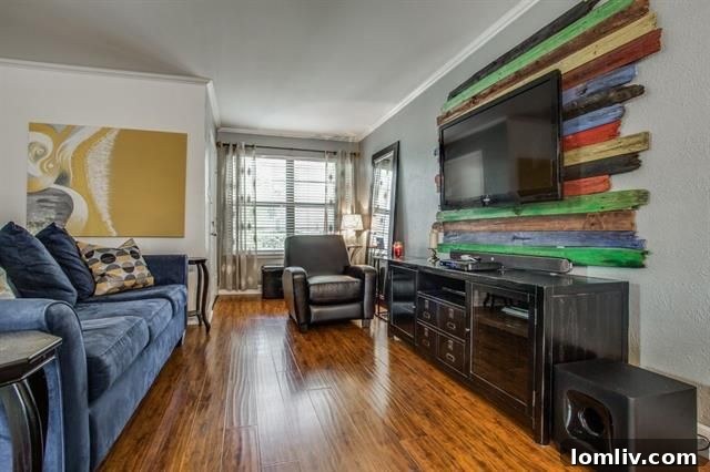 View of the open-concept living and dining area, featuring beautiful hardwood floors and a seamless flow between spaces.