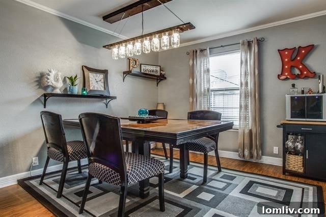 Modernly updated kitchen with white cabinetry, stainless steel appliances, and a convenient layout for cooking.