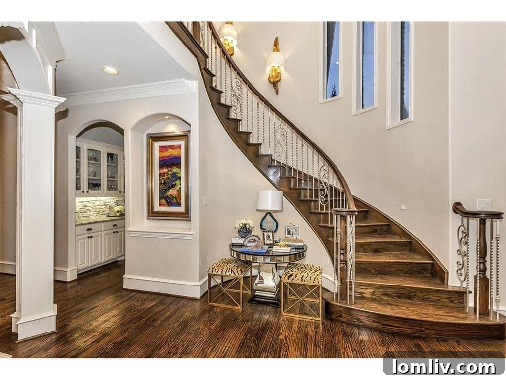 Elegant staircase design in Shay Geyer's Frisco home, showcasing transitional luxury.