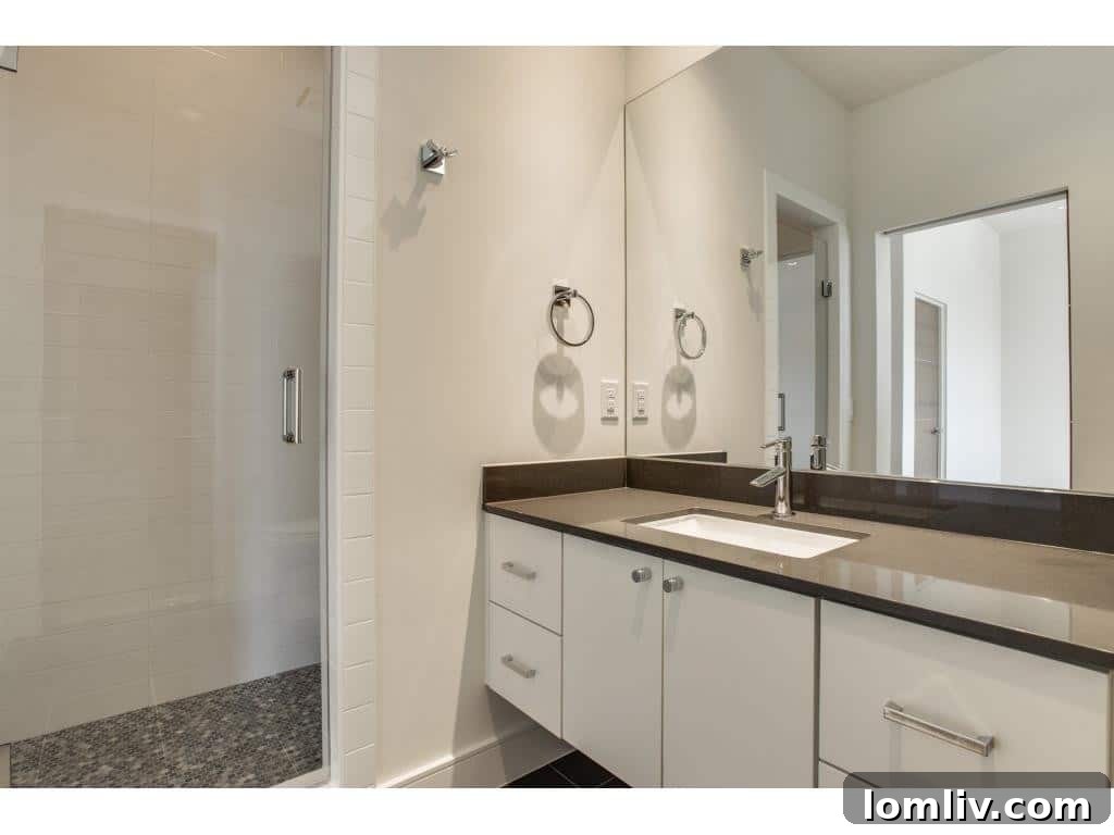 Modern Family Bathroom with Dual Sinks and Contemporary Fixtures
