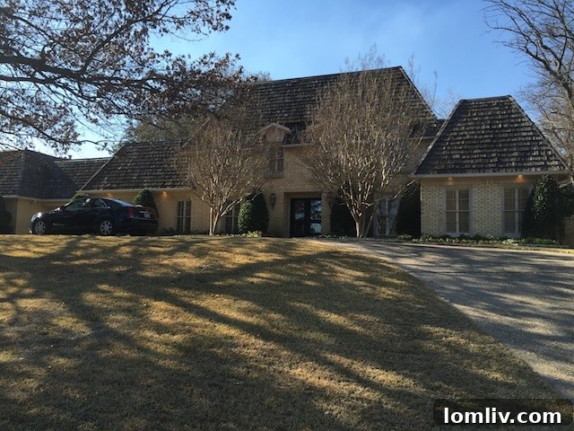 Elegant Mansard Roof Home Exterior at 1512 Shady Oaks Lane in Westover Hills