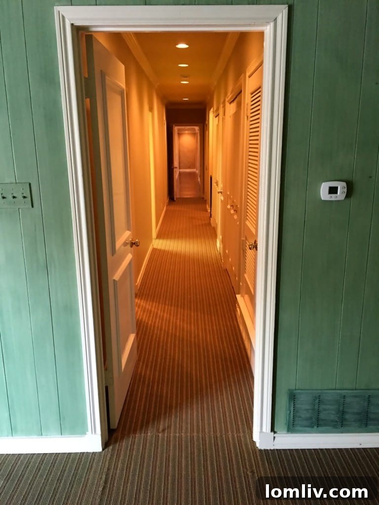 Upstairs Bedroom with Terrace Access and Views of the Lush Backyard