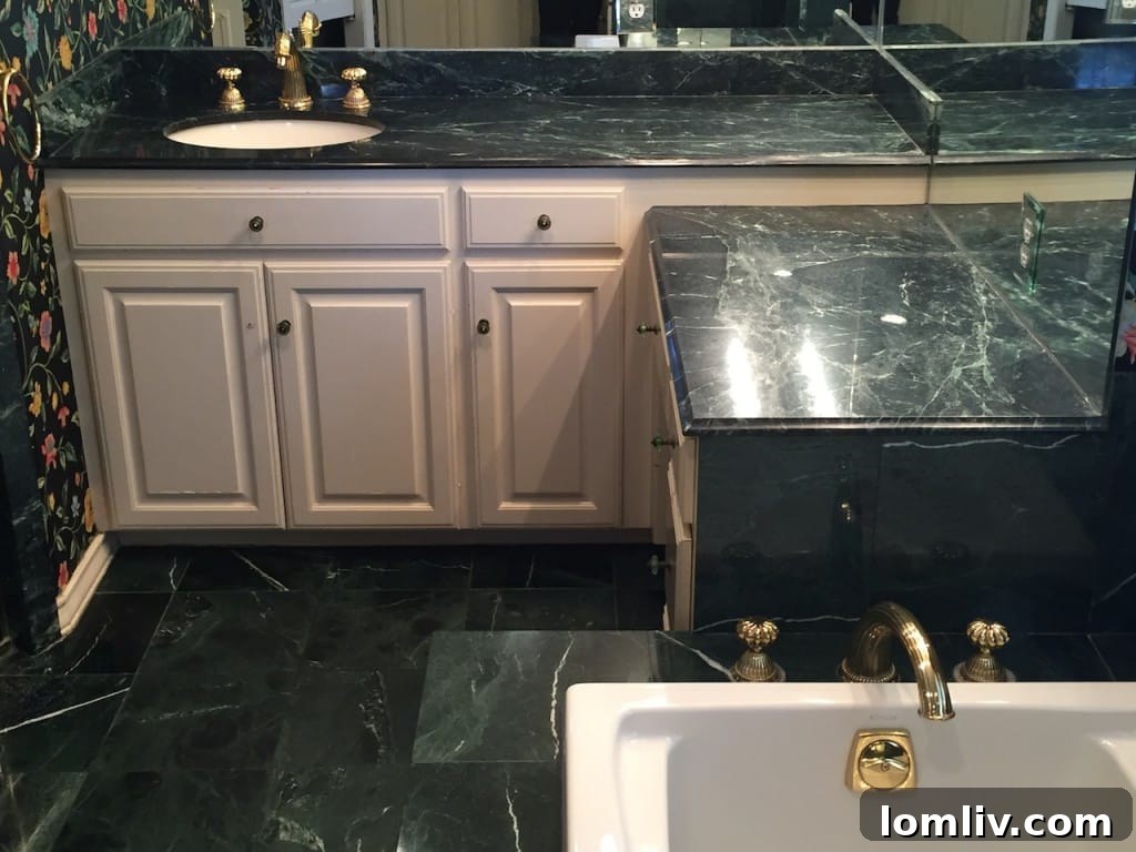 Luxurious Master Bathroom with Jade Green Granite Countertops and Dual Vanities