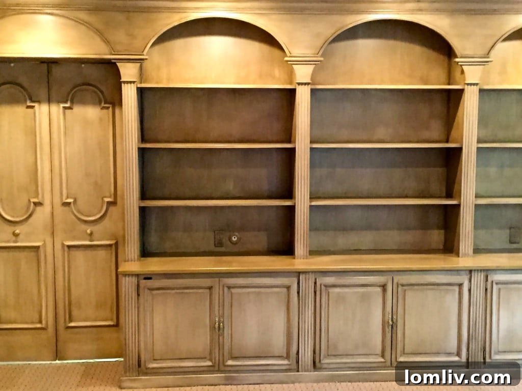 Cozy Paneled Den with Wet Bar and Custom Built-ins