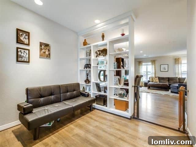 Lush backyard with mature trees and detached two-car garage