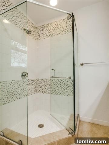 Detail of the sophisticated built-in bookshelf dividing living areas