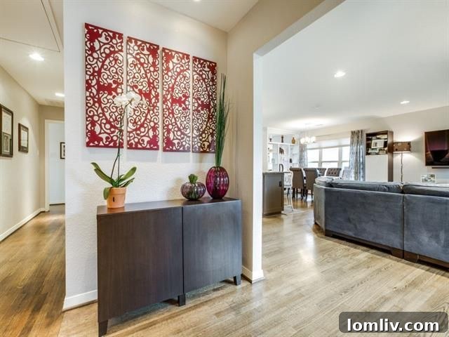 View of the open concept living space and dining area with built-in bookshelf