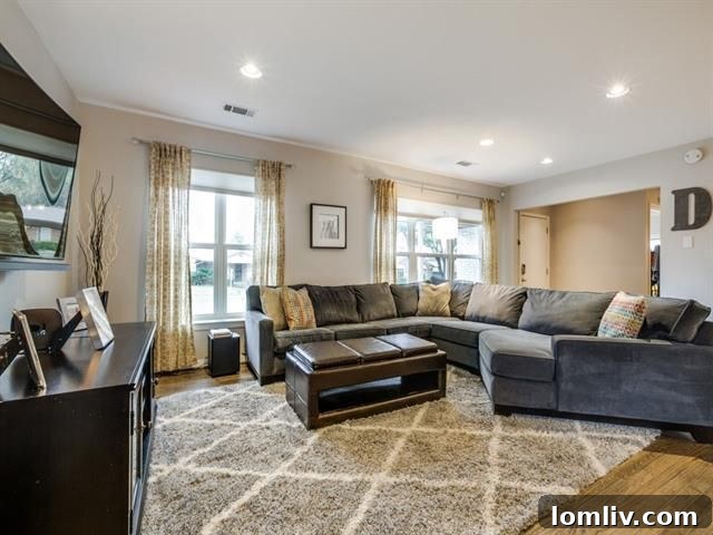 Gleaming stainless steel appliances and glass tile backsplash in the kitchen