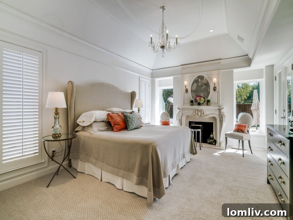 Luxurious Master Bedroom with Fireplace and Crema Marfil Marble