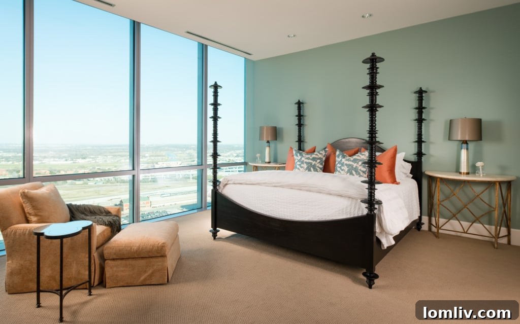 Opulent master bathroom with deep soaking tub and marble finishes
