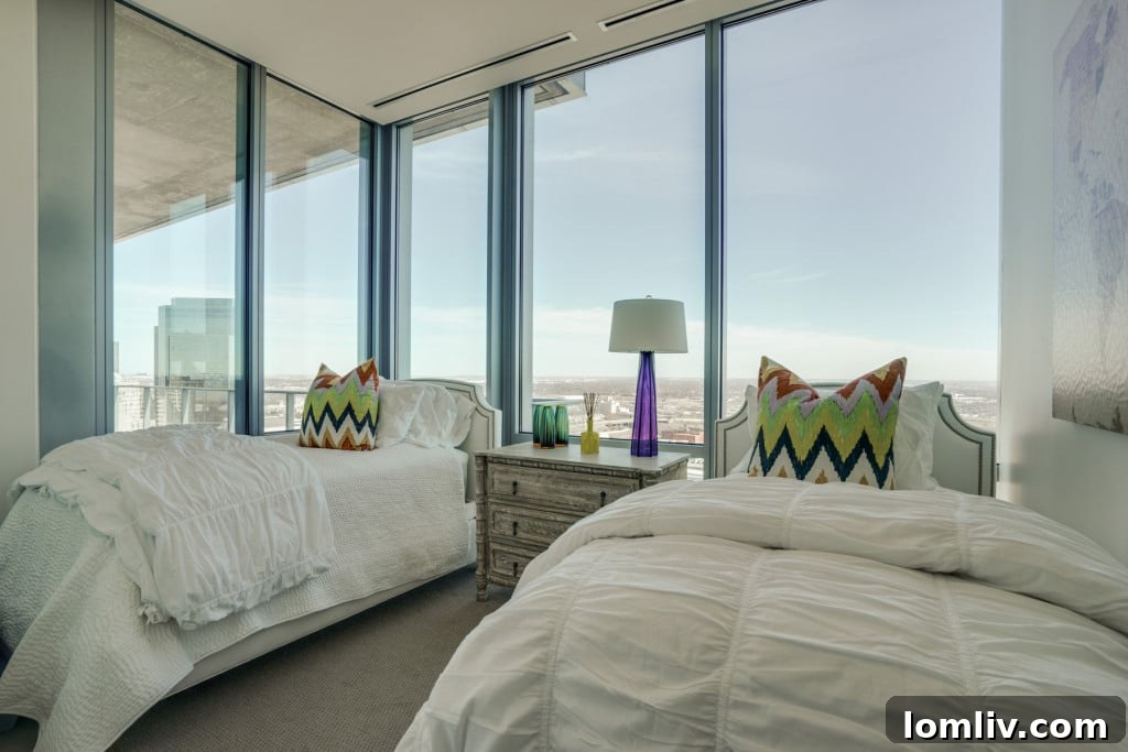 Guest bedroom with stunning city views and designer furnishings
