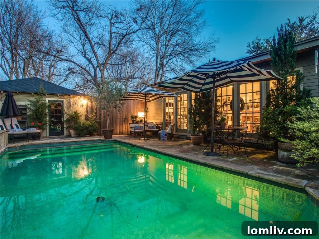 Open-plan kitchen and family room with designer lighting