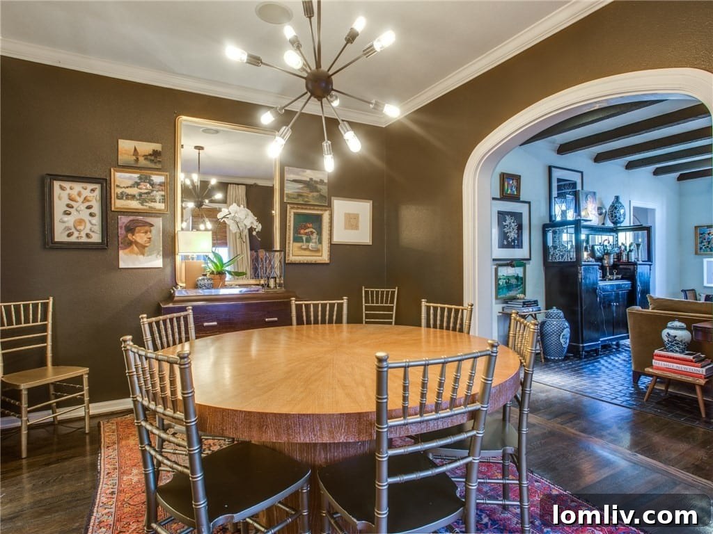 Elegant dining room with arched entryway and built-in bookshelves
