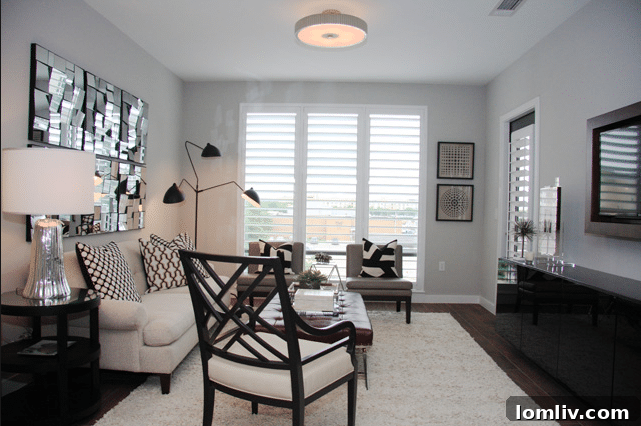 Contemporary bathroom with double vanity and large mirror at The Shelby Residences
