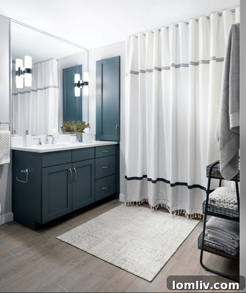 An inviting living area with a fireplace and contemporary artwork in a Shelby Residences model