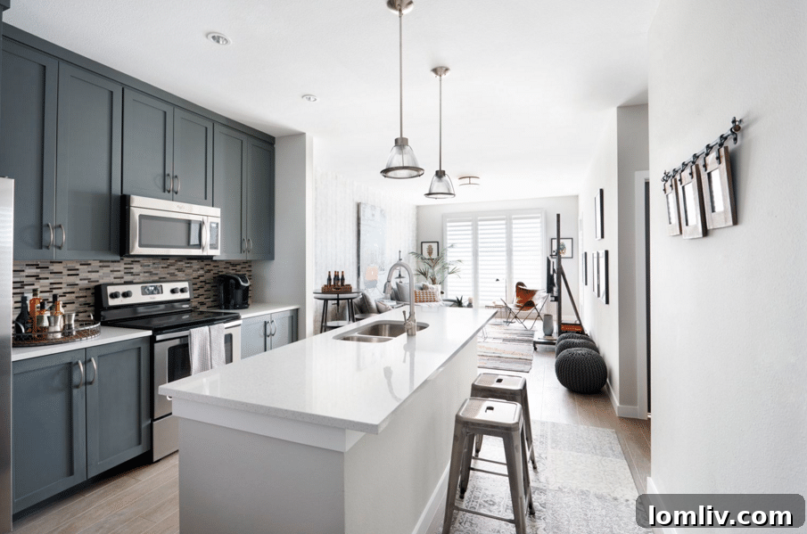 A contemporary kitchen in The Shelby Residences, showcasing quartz countertops and custom cabinetry