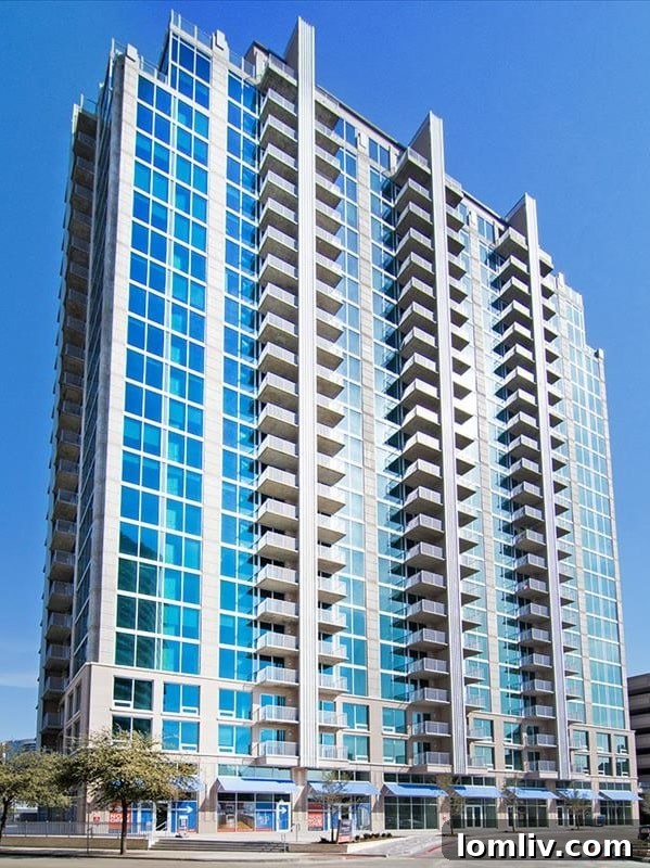 SkyHouse Dallas, a tall residential building with many windows, against a blue sky