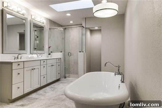 Spa-like primary ensuite bathroom with a classic clawfoot tub at 7037 Royal Ln