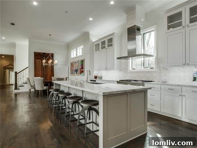 Your Weekend Passport to 5 Stellar Dallas Open Houses 15 Elegant kitchen with high-end finishes and a large island, ideal for entertaining