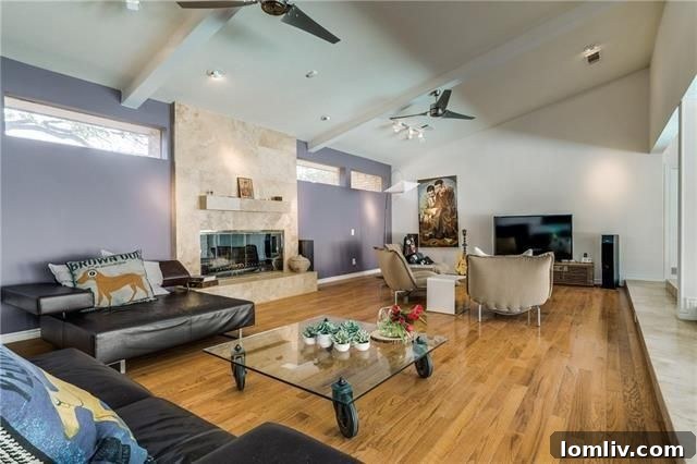 Your Weekend Passport to 5 Stellar Dallas Open Houses 4 Spacious living area with soaring ceilings and an architectural staircase at 6868 Meadowcreek Drive