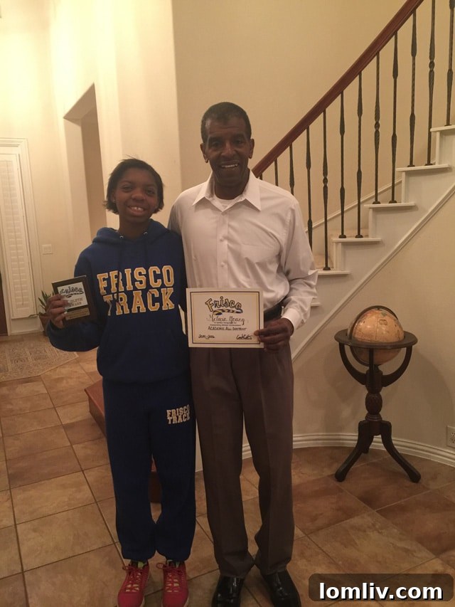 Al Young proudly stands with his daughter, Melecia, a talented athlete and scholar