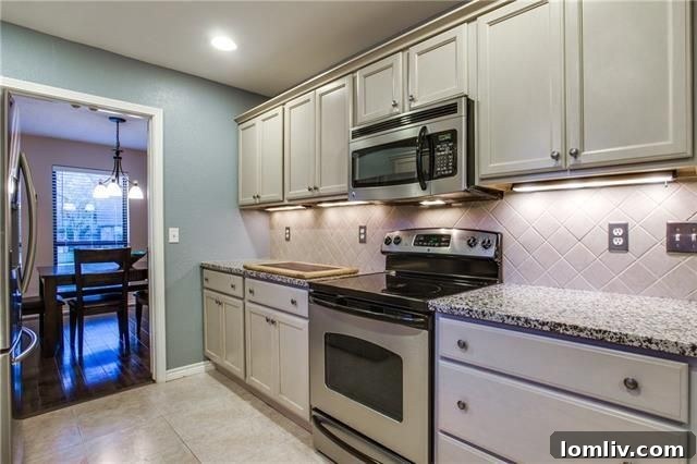Second living area with a vaulted ceiling and skylights