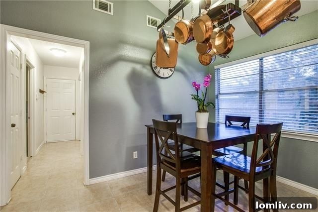 Close-up of granite countertops and white cabinetry in the kitchen
