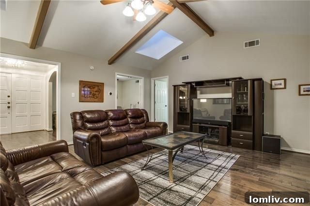 View of the spacious backyard and covered patio