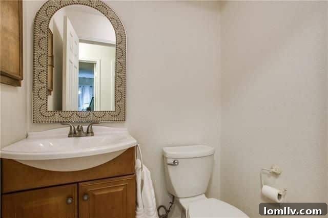 Elegant white cabinetry and stainless steel appliances