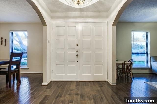 Lush green backyard with a privacy fence at 12030 Loch Ness Drive