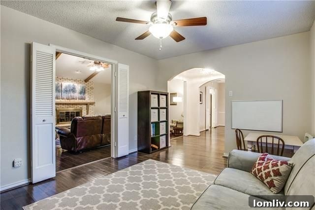 Bright formal living room featuring new hardwood floors