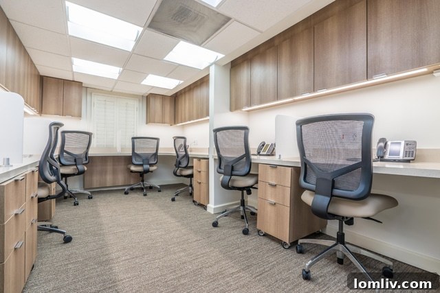 A contemporary seating arrangement in a common area, featuring modern furniture and elegant lighting for collaborative interactions
