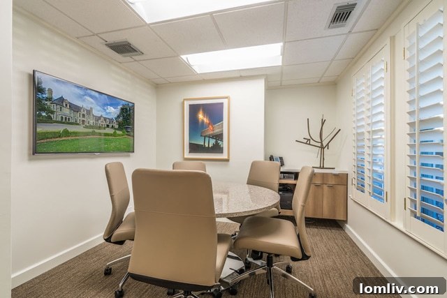 Artwork display in a hallway, showcasing curated pieces from local Dallas galleries, adding cultural depth