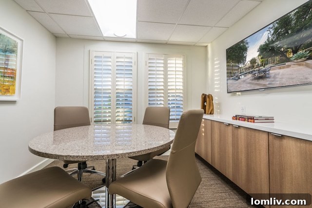 A view into a brightly lit office space, highlighting the fresh and modern interior design elements and natural light