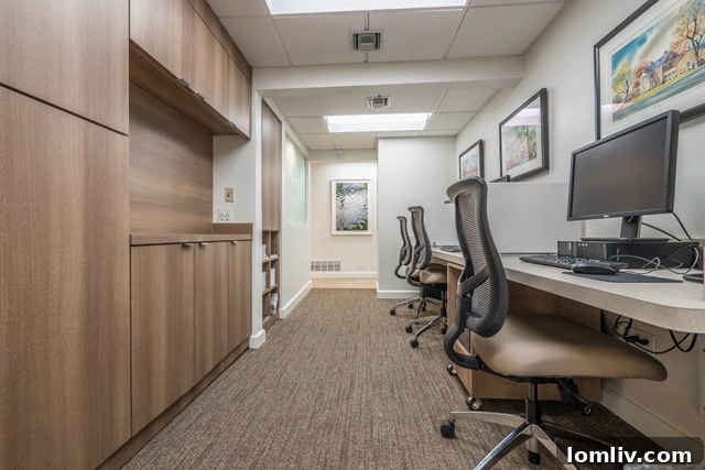 Another view of a spacious and elegantly designed lounge area in the renovated Ebby Halliday office, promoting comfort